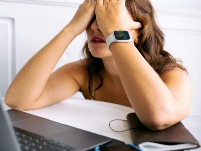 A woman covering her face